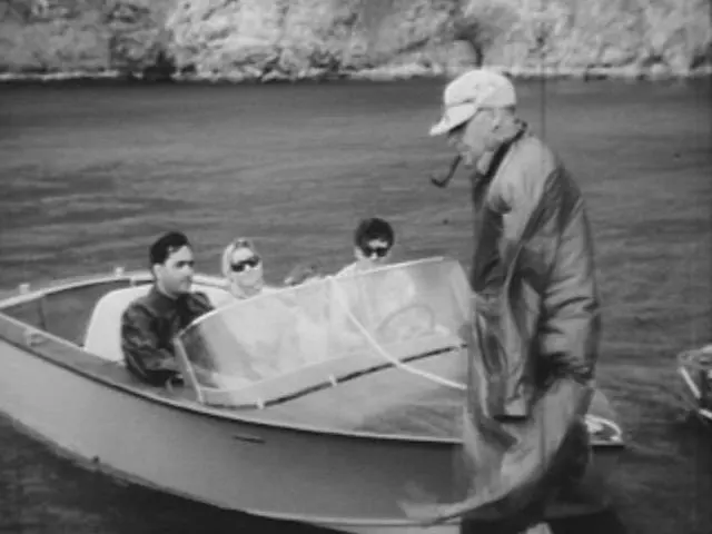Jack Brabham tries out the jet boat, 1960
