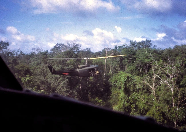 A helicopter hovers above the jungle - SAS 'hot extraction'