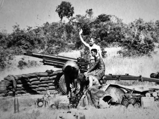Gun crew firing an L5 pack howitzer