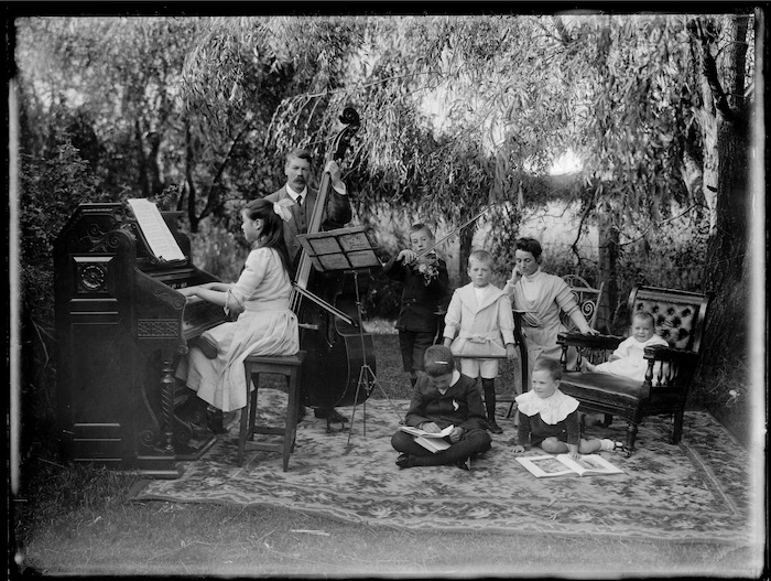 James McAllister and family, outside, with musical instruments, Stratford, Taranaki